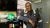 bp employee standing next to filing cabinet smiling