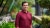 Man wearing red shirt smiling