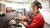 A barista makes coffee at a wildbean cafe in New Zealand