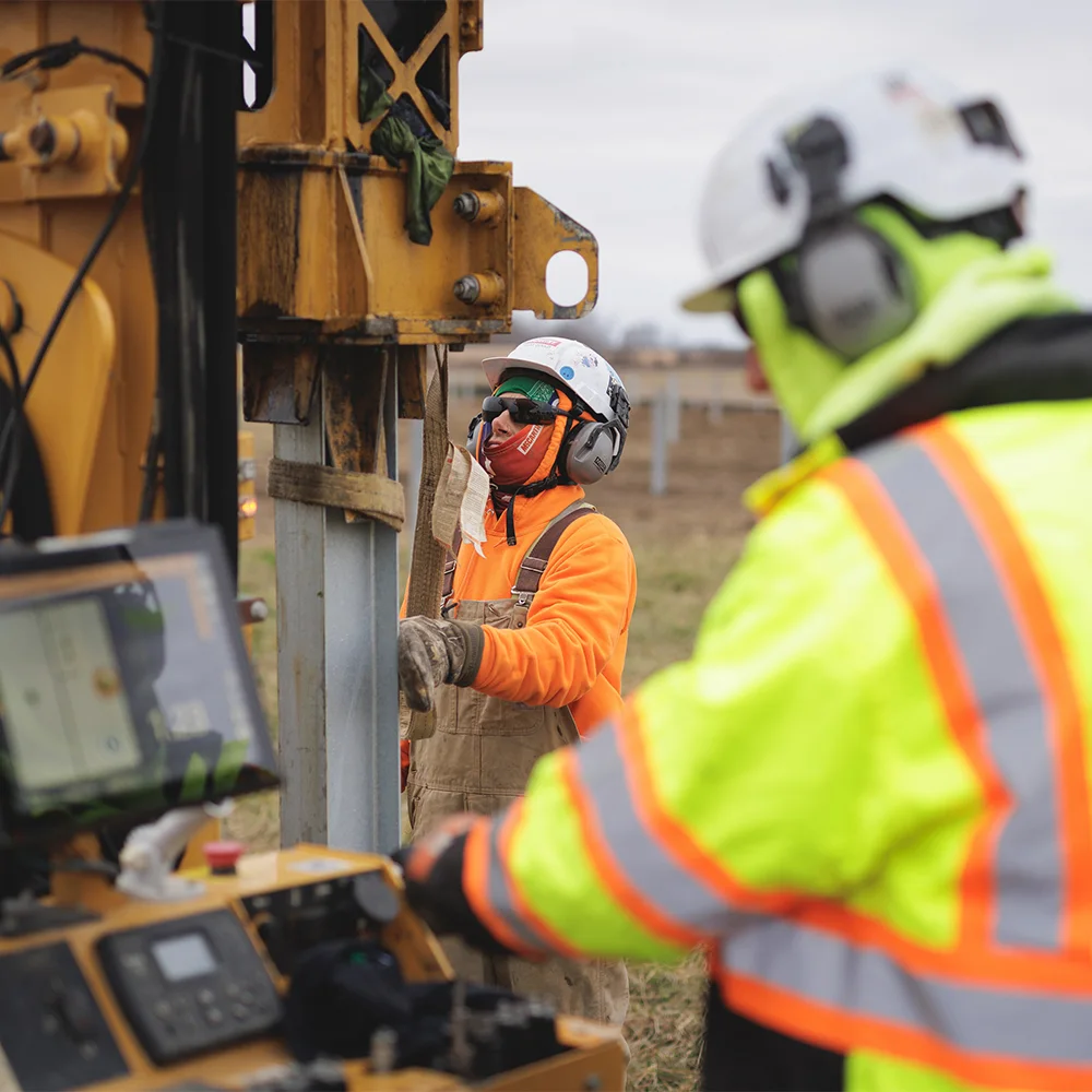 Driving stakes into the ground for construction of the Arche solar project in Ohio, US